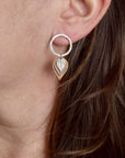 Close-up detail of hammered square rod circle with brass, copper, and sterling silver leaf dangles