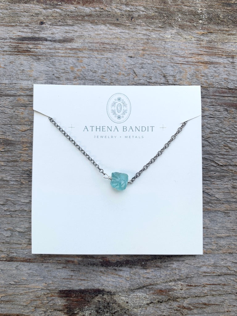 Raw blue green apatite gemstone float necklace on jewelry card