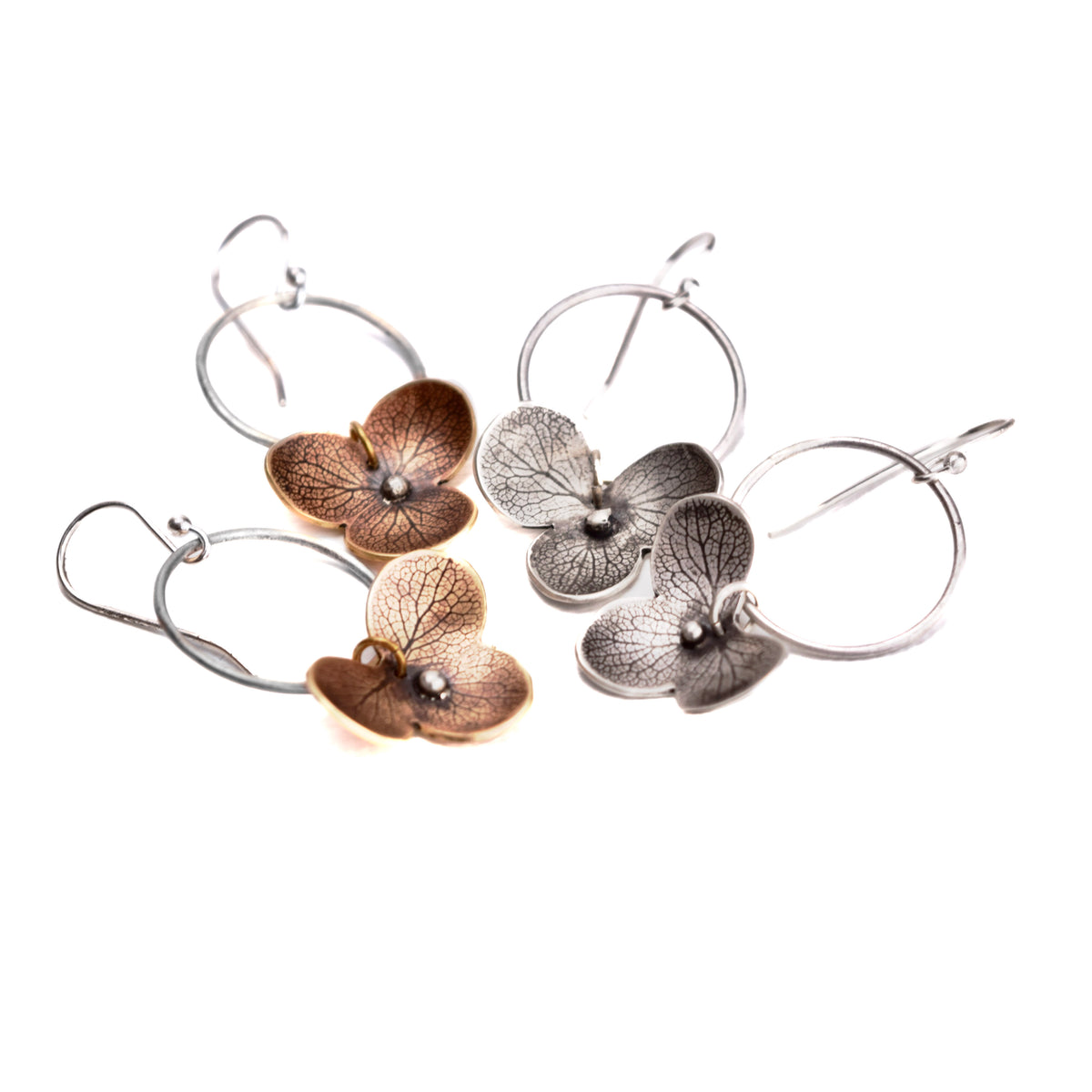 Handmade sterling silver hydrangea flower impression dangle earrings with satin finish and patina.