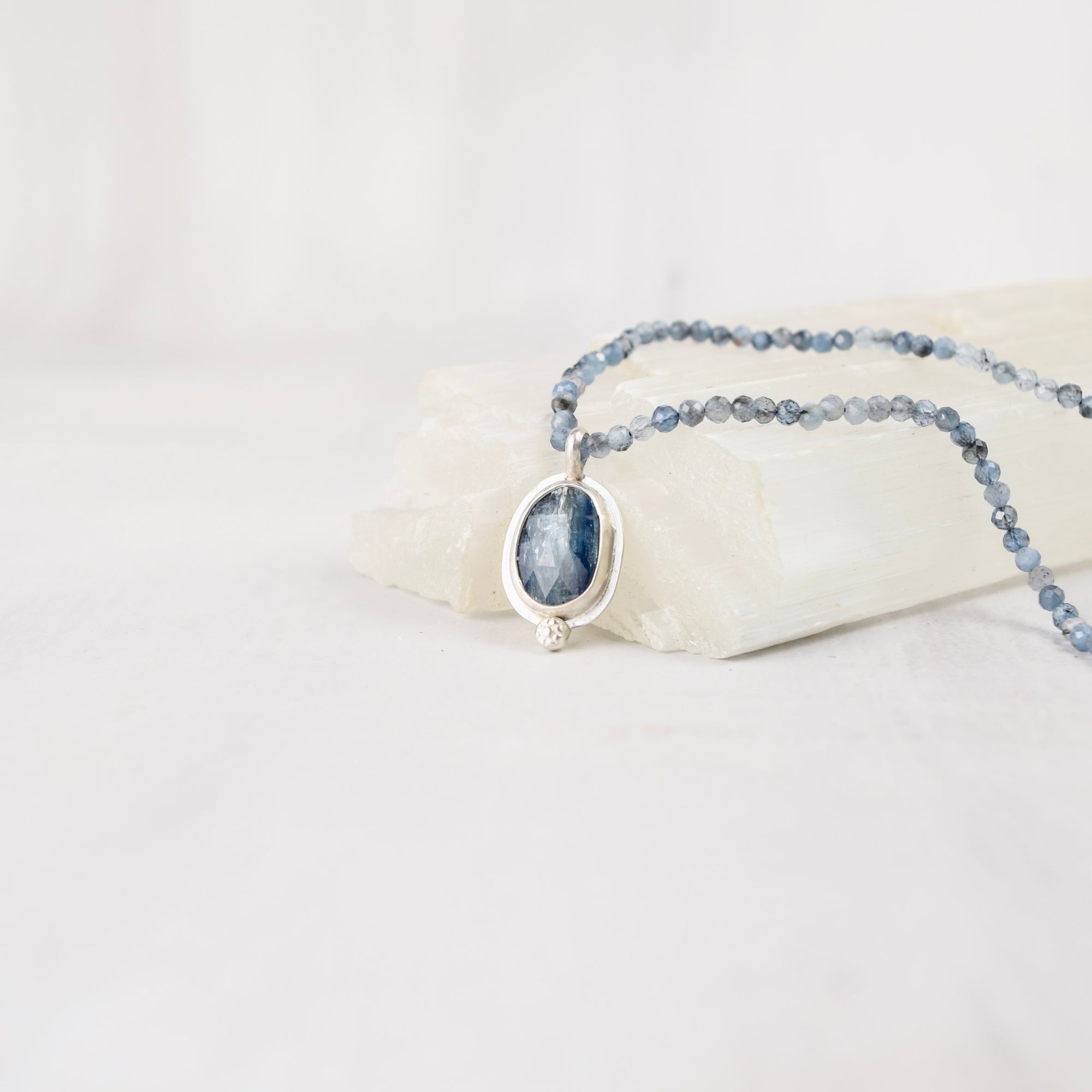 Blue kyanite cabochon pendant necklace with aquamarine beaded strand, front facing view