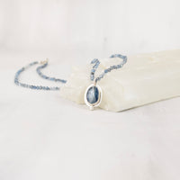 Handmade sterling silver necklace with faceted blue kyanite and aquamarine beads, close front view