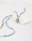 Close-up of faceted oval blue kyanite cabochon set in sterling silver