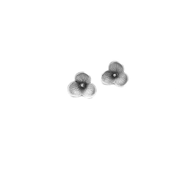 Handmade sterling silver hydrangea flower impression stud earrings with delicate petal and vein detail, crafted in Vermont