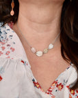 Model wearing handmade sterling silver hydrangea petal impression choker necklace, delicate botanical bridal jewelry handcrafted in Vermont