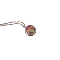 Overhead view of one of a kind handmade sterling silver pink plume agate necklace in hammered bezel setting on substantial 3.1mm chain, artisan gemstone jewelry crafted in Vermont