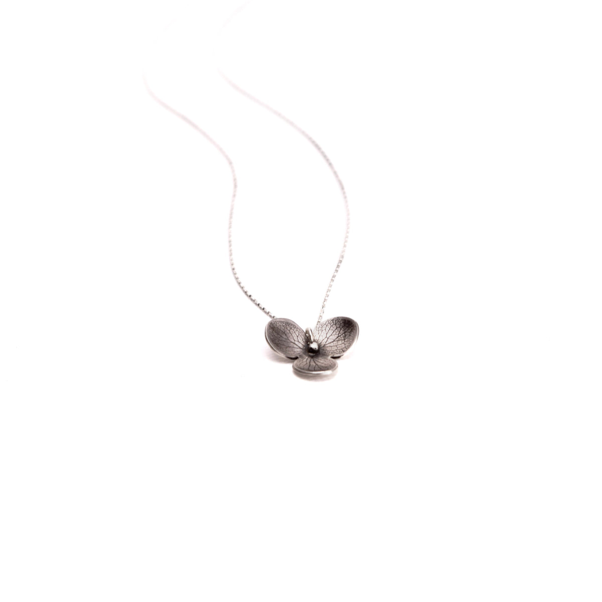 Handmade sterling silver hydrangea flower impression charm necklace with satin finish and high polish edges, nature inspired jewelry crafted in Vermont